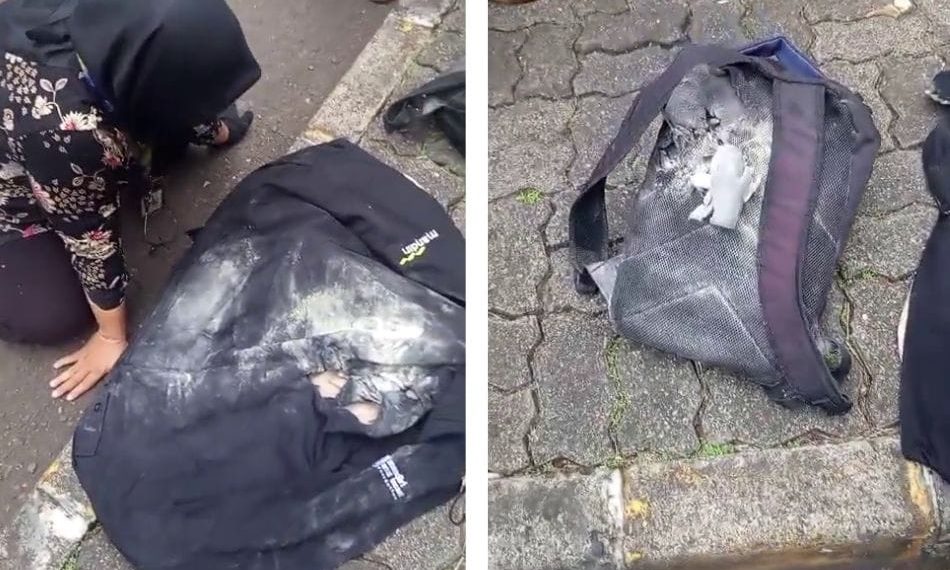 Seorang ibu tampak kesakitan sambil duduk di pinggir jalan setelah insiden demo DPR, punggungnya tampak meradang dan laptopnya rusak. Sumber: Ayobandung.com