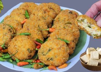 Potongan perkedel tahu yang telah matang menunjukkan tekstur luar yang garing dan dalam lembut; bahan utamanya hanya tahu dan telur. (Sumber foto: Youtube / Bagja Vlog)