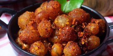 Cimol Bojot viral di media sosial karena sensasi pedas dan kenyalnya. Simak resep lengkapnya untuk dibuat di rumah dengan rasa mirip jajanan Bandung asli. (Foto: Cookin.id)