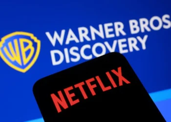 Pertemuan pimpinan Warner Bros Discovery dan Netflix memperkuat spekulasi akuisisi studio hiburan raksasa. (Foto: REUTERS/Dado Ruvic/Illustration)