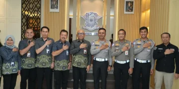 Uji coba sistem SIM wajib BPJS aktif dilakukan di Medan. Pemohon kini harus terdaftar JKN untuk mengurus SIM. Simak penjelasannya. (Foto: Dokumentasi BPJS Kesehatan)