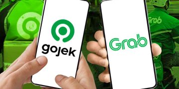 Masuknya Danantara ke saham aplikator ojol dinilai jadi sinyal kuat merger Gojek dan Grab. Analis soroti dampak ke pasar dan pengemudi. (Foto: Bloomberg Technoz)