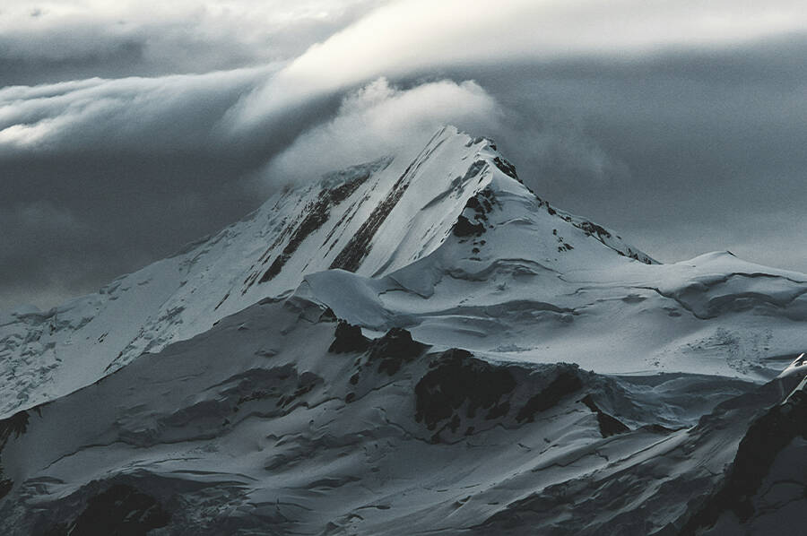 snow-covered-mountain-under-white-clouds Admiral Byrd Antarctica